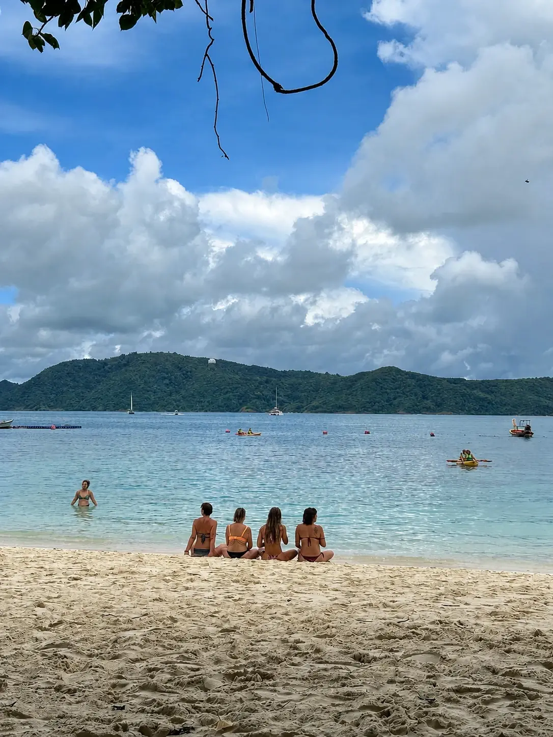 Yoga teacher training students on a beach in Phuket, Thailand